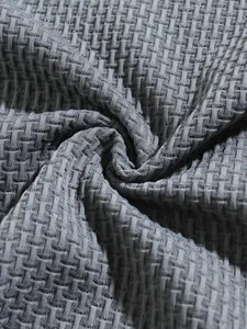 Macro detail of gray waffle-weave stretch fabric texture for men's sports polo shirt
