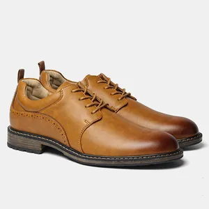 Detailed side view of classic brown leather business shoes for men with elegant brogue patterns