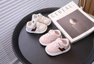 Infant toddler walking shoes featuring soft soles and breathable anti-slip sports design