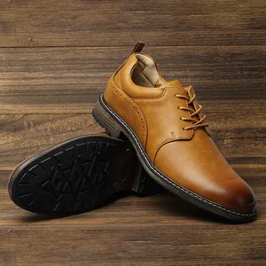 Close-up showing the textured outsole and elegant brogue details of brown dress shoes