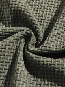 Macro detail of breathable olive green waffle texture fabric for men's polo shirt