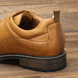 Close-up detail of brown men's brogue dress shoe with perforated leather design