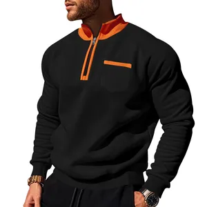 Detailansicht eines schwarzen und orangefarbenen Fleece-Sweatshirts mit halbem Reißverschluss