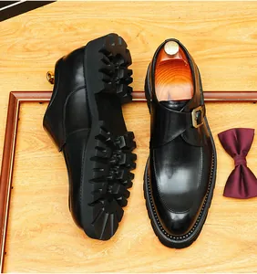 Detailed view of premium black leather monk strap shoes featuring thick lug soles