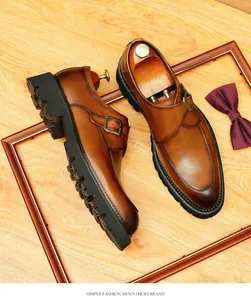Detailed view of brown leather monk strap shoes with thick lug soles