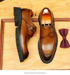 Detail view of men's brown leather monk strap derby shoes with platform sole