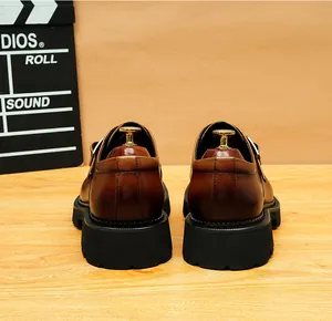 Close-up back view of men's vintage brown thick-soled leather derby shoes with platform.
