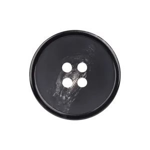 High-quality black resin button with four holes and white marble texture on white background.