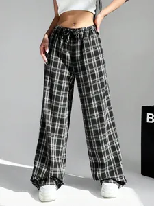 High-waisted black and white plaid wide-leg trousers for a stylish casual streetwear look.
