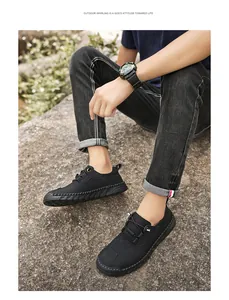 Vue détaillée des chaussures décontractées en cuir noir pour hommes avec couture à la main
