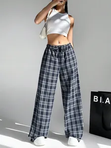 Fashionable navy plaid wide-leg trousers with drawstring waist shown on a female model