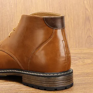 Close-up view of vintage brown leather desert boot heel featuring detailed stitching