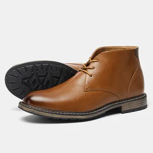 Side view detail of classic brown leather desert boots for men with textured rubber sole
