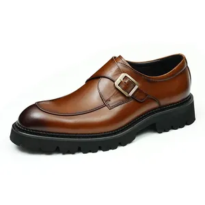 Classic men's brown leather monk strap shoes with thick rubber lug soles and buckle.