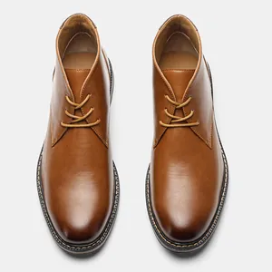 Top-down macro view of men's brown retro desert boots with classic lace-up design
