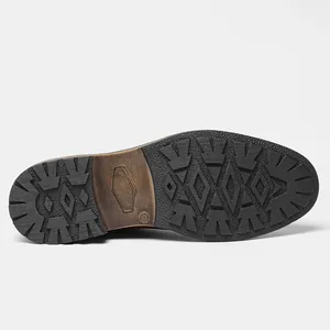 Detail of the durable rubber sole with size 42 marking on men's vintage leather boots