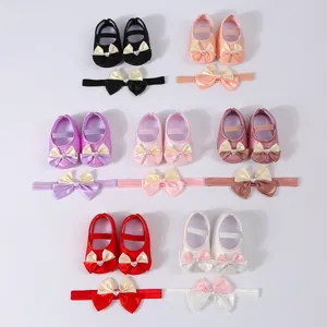 Collection of colorful baby princess shoes and matching bow headbands in soft satin.