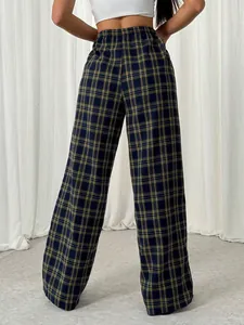 Rear view of stylish navy and yellow plaid wide-leg trousers for women in casual daily style