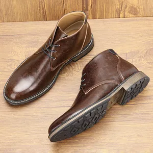 Detailed view of men's retro brown leather chukka boots showing texture and sole