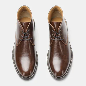 Professional top-down view of classic men's vintage brown leather chukka desert boots