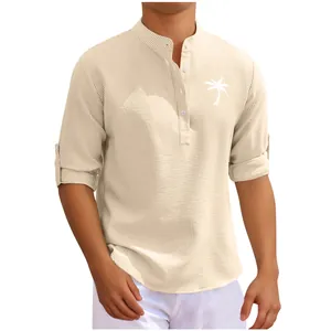 Detailed view of men's beige stand collar shirt with waffle texture and palm tree print