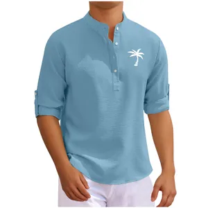 Detail view of blue waffle-knit men's long sleeve shirt with palm tree print