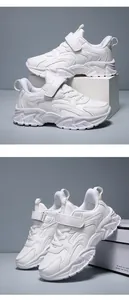 Detailed side view of white children's sports running shoes with secure velcro strap
