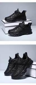 Close-up view showing the texture of black children's athletic sneakers on a display box.