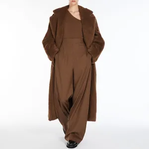 Elegant long brown teddy coat for women paired with matching wide-leg trousers outfit