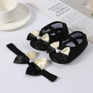 Elegant black baby princess shoes and matching headband set with cream satin bows