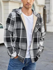Outdoor shot of men's plaid hooded flannel jacket featuring a cozy fleece lining