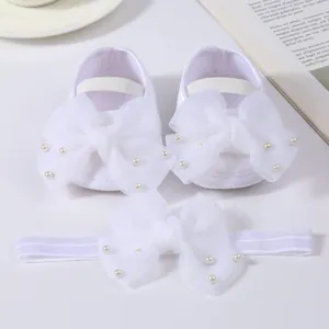 Elegant white baby shoes and matching headband set with tulle bows and pearl beads