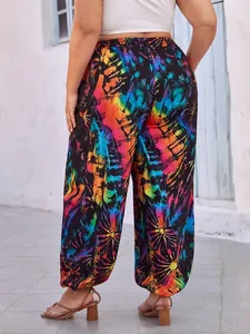 Back view of plus size wide-leg trousers with colorful tie-dye sunburst print.