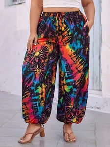 Close-up detail of women's plus size colorful tie-dye print loose casual wide-leg pants on model