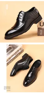 Classic black men's leather brogue shoes with elegant wingtip detail and laces.