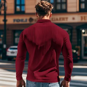 Macro view of burgundy long-sleeve ribbed polo shirt showing slim fit and fabric texture