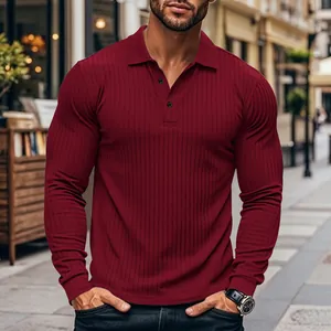 Detailed view of the burgundy ribbed texture on a men's slim fit long sleeve polo shirt