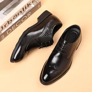 Classic black leather brogue shoes with vintage wingtip carving and textured side panels