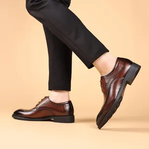 Professional brown leather Brogue dress shoes featuring classic vintage wingtip carving