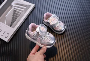 Close-up of pink and silver toddler sneakers with EVA soft sole and velcro strap