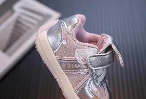 Detailed view of pink mesh and silver leather on toddler girl sneakers with sequins