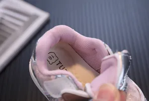 Close-up of pink mesh lining and insole of baby girls microfiber leather sports shoes