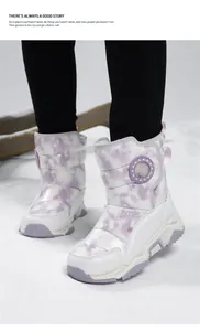 Detail view of children's padded winter snow boots featuring a lavender tie-dye pattern