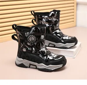 Macro view of kids winter snow boots with silver marble pattern and durable thick soles