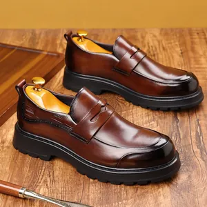 Premium brown men's genuine leather loafers with a thick sole and luxury wooden shoe trees