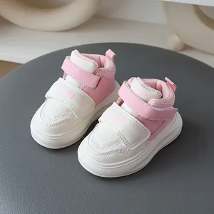 Pink and white toddler sneakers with anti-slip soft soles and velcro straps