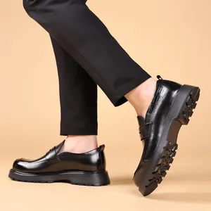 Stylish men's black genuine leather loafers with a platform sole in walking pose