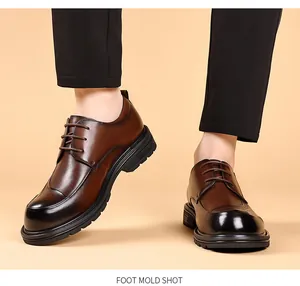 Detailed close-up of men's brown burnished leather business shoes with thick soles