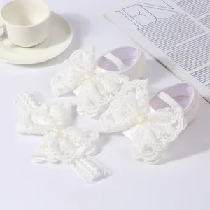White baby princess shoes and matching headband set with elegant lace bows detail