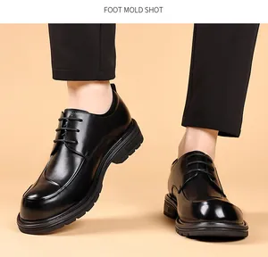 Professional black leather men's business shoes with thick soles on a model foot shot